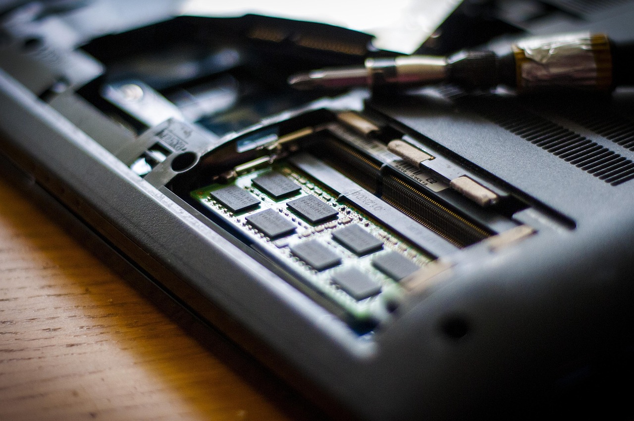 developer typing code laptop